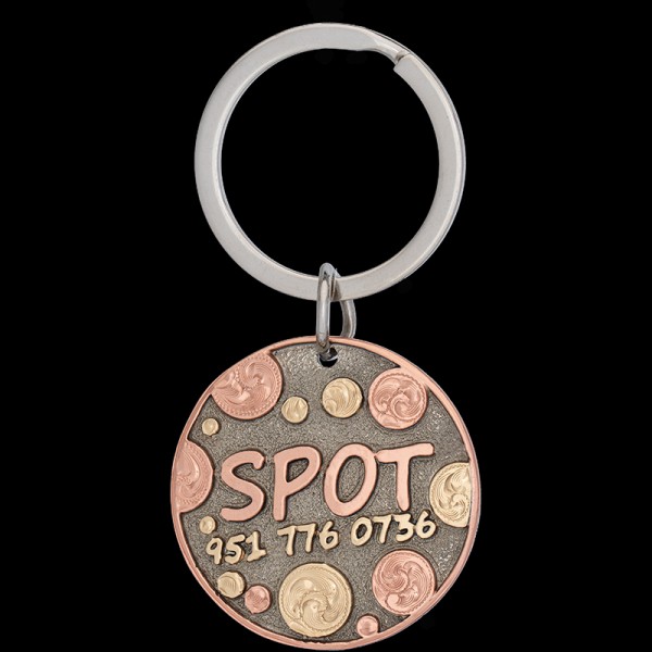 Introducing the Spot Custom Dog Tag! Crafted from durable German silver, adorned with a captivating combination of copper, jewelers bronze letters, and charming circular figures. Order now! 